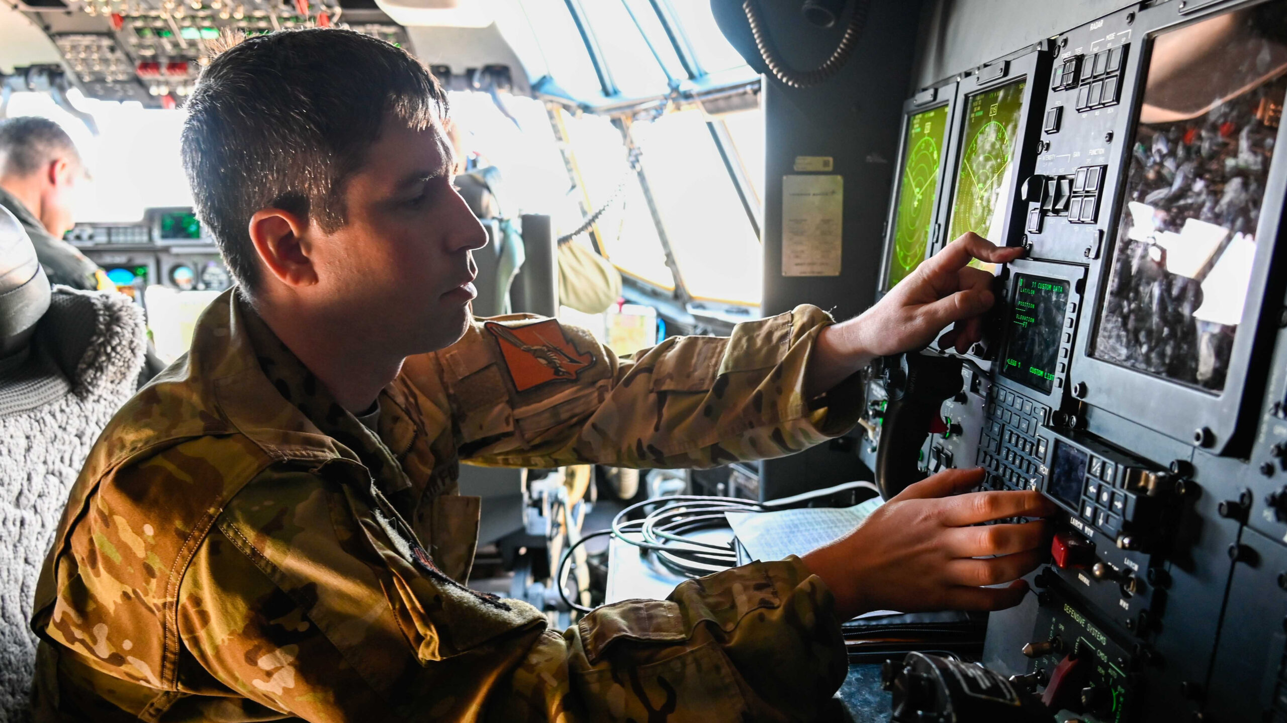 Airman operates navigation and mission systems at the flight station