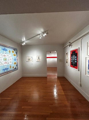 Museum gallery room displaying military-themed artwork